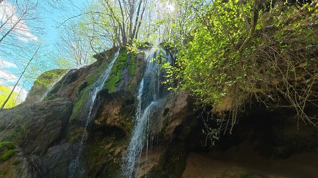 Sunlight breaks through canopy above waterfall. Bigar Waterfall, Stara Planina. (Balkan Mountains), Serbia.