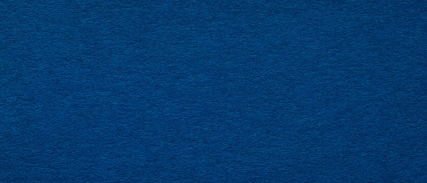Smooth dark blue paper texture background with subtle fiber detail