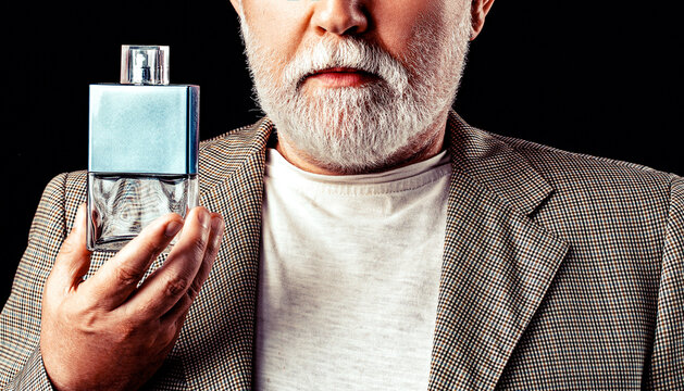 Bottle of perfume. Aged man perfume, fragrance. Perfume or cologne bottle perfumery, cosmetics, scent cologne bottle