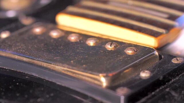 Close up of the small brush cleaning an electric guitar 