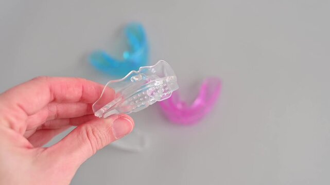 Silicone dental mouth guard trainer for children to correct bite and teeth alignment on a white background