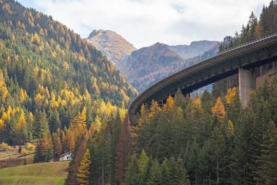 The famous Brenner Pass highway bridge in autumn surroundings with alpine mountains. Gries am Brenner, Tyrol, Austria.
