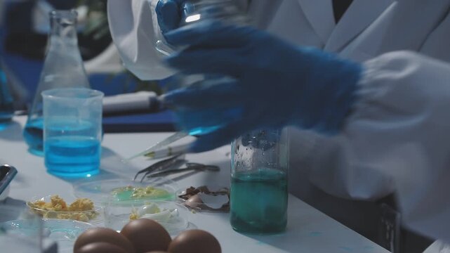 Researcher conducts food analysis in laboratory on eggs and dairy with microscope and data sheet for study on nutrition concept