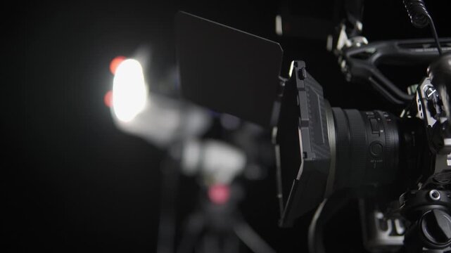 Professional cinema camera on a film set with lighting equipment
