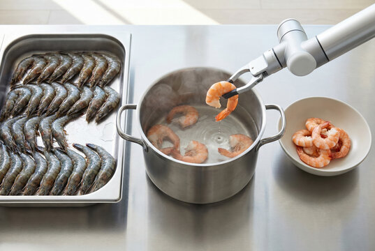Contactless seafood handling concept with a robotic gripper lifting shrimp above hot water. Raw shrimp on a tray and cooked shrimp in a bowl reinforce hygiene, safety, and no-touch cooking workflow