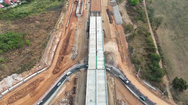 Aerial view drone footage of bridge construction being made across the intersection