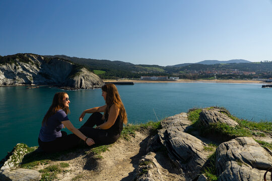 Two women talking at Barrika Cliffs