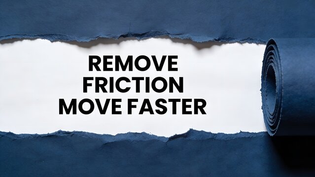 A conceptual photograph showing dark blue paper being rolled back to reveal bold black text that says remove friction move faster on a clean white surface