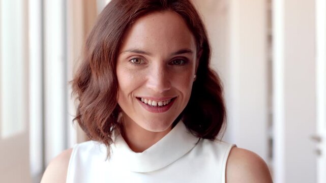Happy, realtor and face of woman in home for property sale, commercial housing and rental listing. Business, real estate and portrait of person with pride, smile and ambition for homeowner consultant
