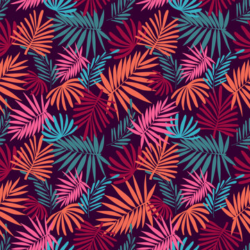 Seamless vector pattern featuring abstract tropical palm leaves in a dense botanical arrangement. Colorful summer and autumn design with silhouettes of fronds in rich shades of deep burgundy, vibrant
