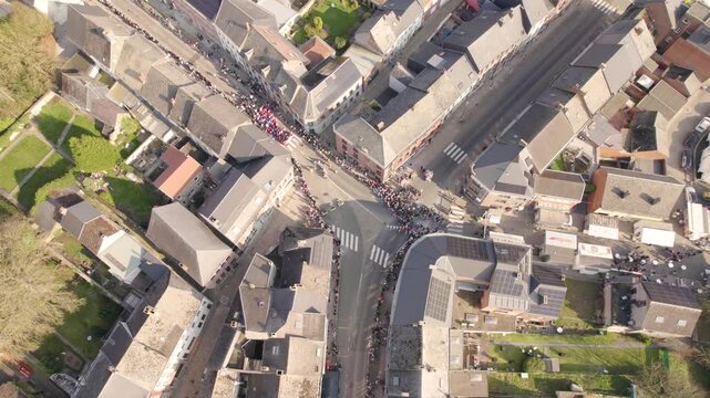 Carnival Parade Procession Moving Through Beaumont Small Town Streets, Aerial Drone Shot