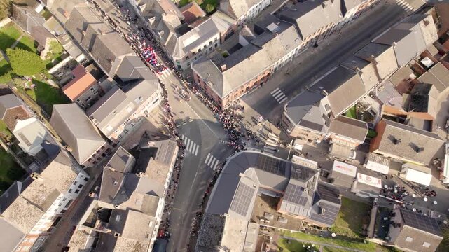 Beaumont Carnival Procession Filling Main Boulevard With Crowd And Costumed Performers, Aerial Drone Shot