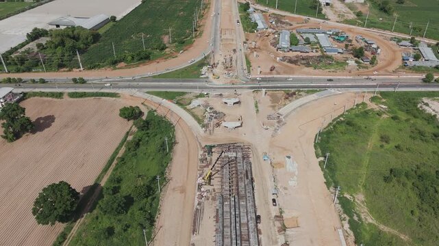 Aerial view drone footage of bridge construction being made across the intersection