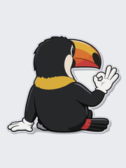 Fototapeta premium Cute cartoon toucan making okay hand gesture sticker