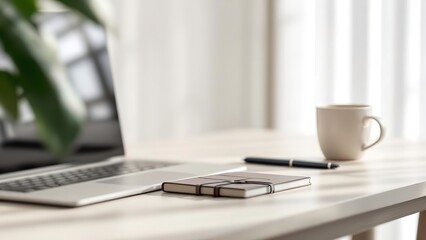 Fototapeta premium Modern home office workspace with a laptop on a wooden desk, featuring indoor plants, a lamp, a coffee cup, and a spiral notebook in a bright, sunlit room