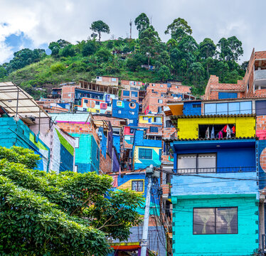 Colombia, Medellin, Comuna 3, Manrique, colourful painted houses built on the slope.	
