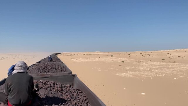 Riding the Mauritania Iron Ore Train Across the Sahara Desert Landscape