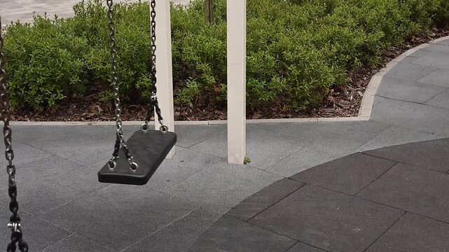 Close view of empty swing seat in playground