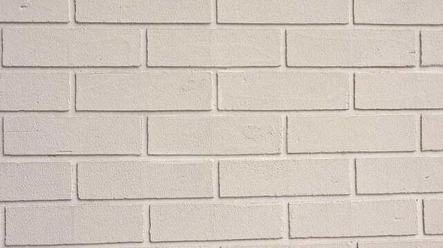 Close-up video of white painted brick wall texture