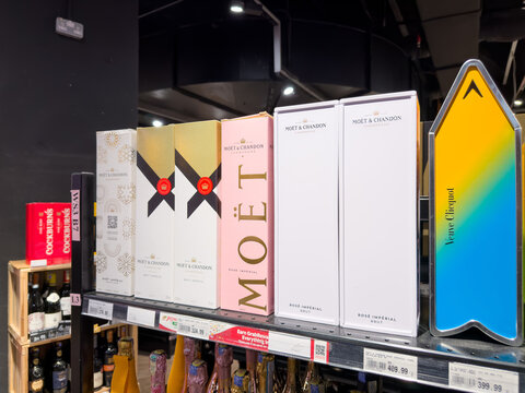 PENANG, MALAYSIA - FEB 05, 2026: Mo&euml;t & Chandon and Veuve Clicquot champagne gift boxes displayed on retail liquor store shelf.