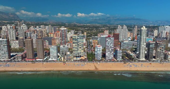 Benidorm spain drone aerial panorama view skyscrapers beach hotels sea line city skyline levante costa blanca tourist destination summer resort mediterranean waterfront real estate vacation travel