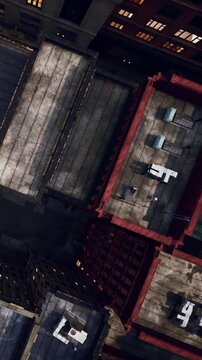 Several rooftops are visible in an urban setting. Different types of furniture are scattered across the rooftops. Some areas are empty while others have seating.