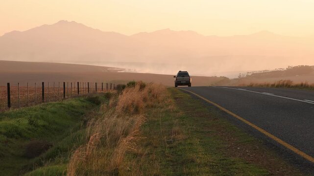 highway through farmland at sunset, , Western Cape, South Africa