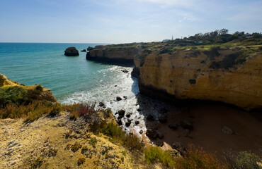 Fototapeta premium Beautiful ocean landscape. Rocks, turquoise water, and beach. Vacation travel.