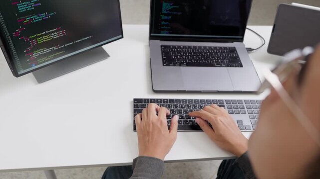 Coding session modern office digital content indoor environment overhead view remote work inspiration