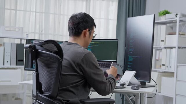 Programming session in modern home office remote work digital workspace indoor environment focused view productivity concept