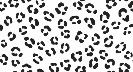 Fototapeta premium A repeating black leopard spot pattern on a white background