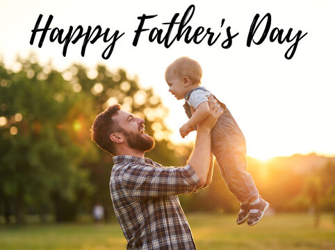 Happy father lifting young child outdoors in park during sunset, joyful family moment