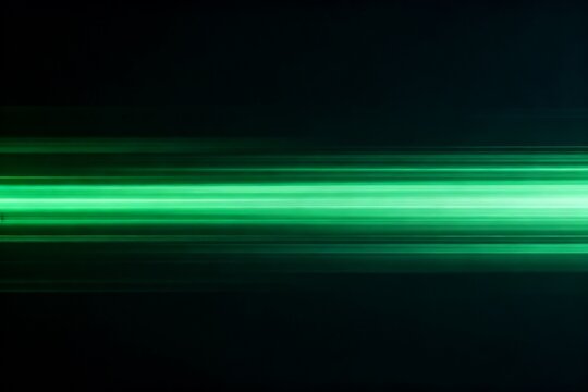 Green light streaks on dark background
