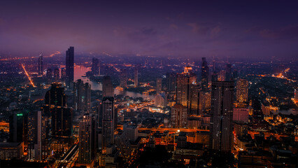 Fototapeta premium City at night with urban buildings. Aerial view, Bangkok< Thailand