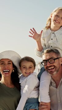 Face, parents and children at beach with summer holiday, smile and bonding together for family trip. Happy people, mother and father outdoor by ocean with girl kids, travel vacation and connection.