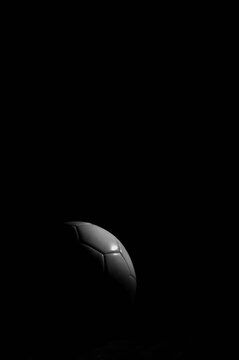 Soccer ball on black background