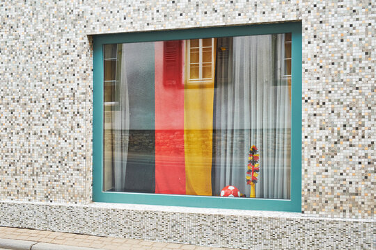 German flag and soccer ball in window