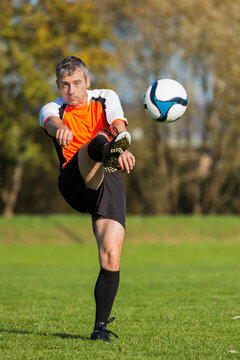 Soccer player kicking ball