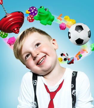 Little boy with flying toys around his head, Composite