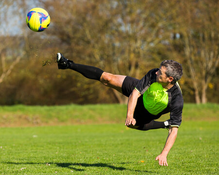 Soccer player kicking ball