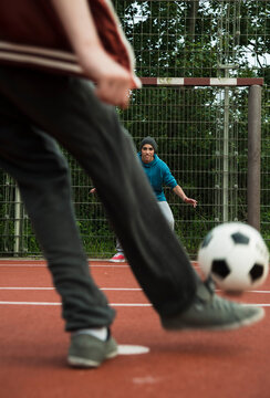Two boys playing soccer