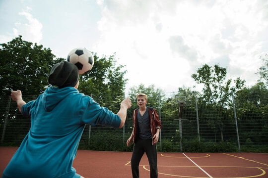 Two boys playing soccer