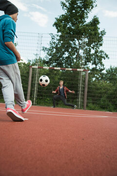Two boys playing soccer