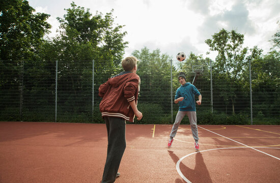 Two boys playing soccer