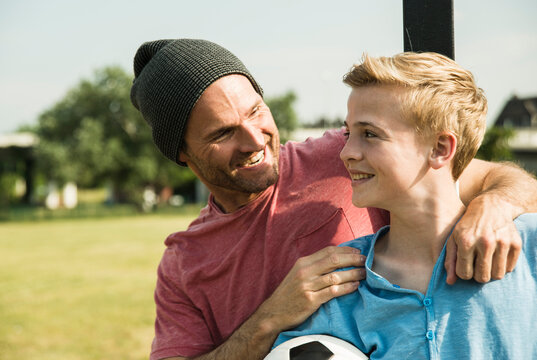 Germany, Mannheim, Father and son playing soccer