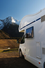 White Camper Van Parked In Snowy Mountains © 9parusnikov