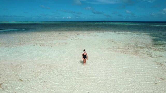Aerial Drone Shot of Woman Walking on Shallow Water in Majuro Atoll