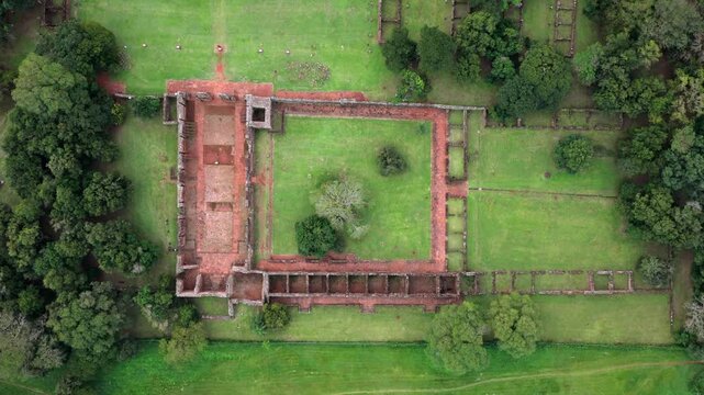 An overhead view captures the San Ignacio Mini ruins surrounded by lush greenery. Ideal for historical documentaries or travel features.