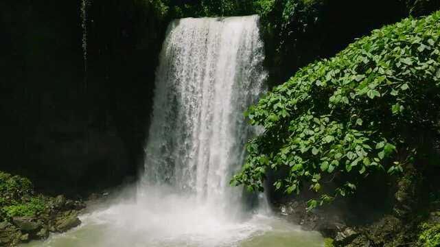 Cold water stream in slow motion view. Hikong Alo Falls. Lake Sebu. Mindanao, Philippines.