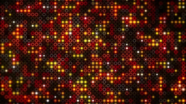 A vibrant horizontal background filled with a dense pattern of small circular rings illuminated with bright orange, red, and yellow glowing lights digital billboard. Loop animation.